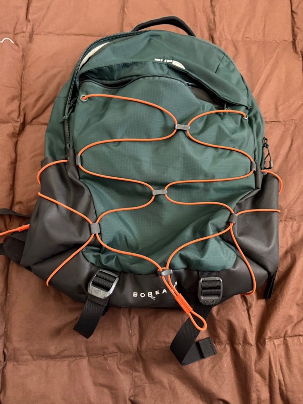 The North Face Green Backpack with Orange Bungee Cord
